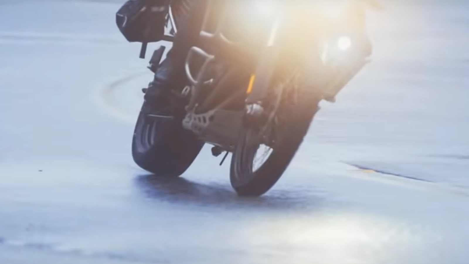 A motorcycle fitted with a car tyre on the rear wheel